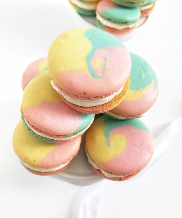 Pink, yellow, and blue swirl macarons