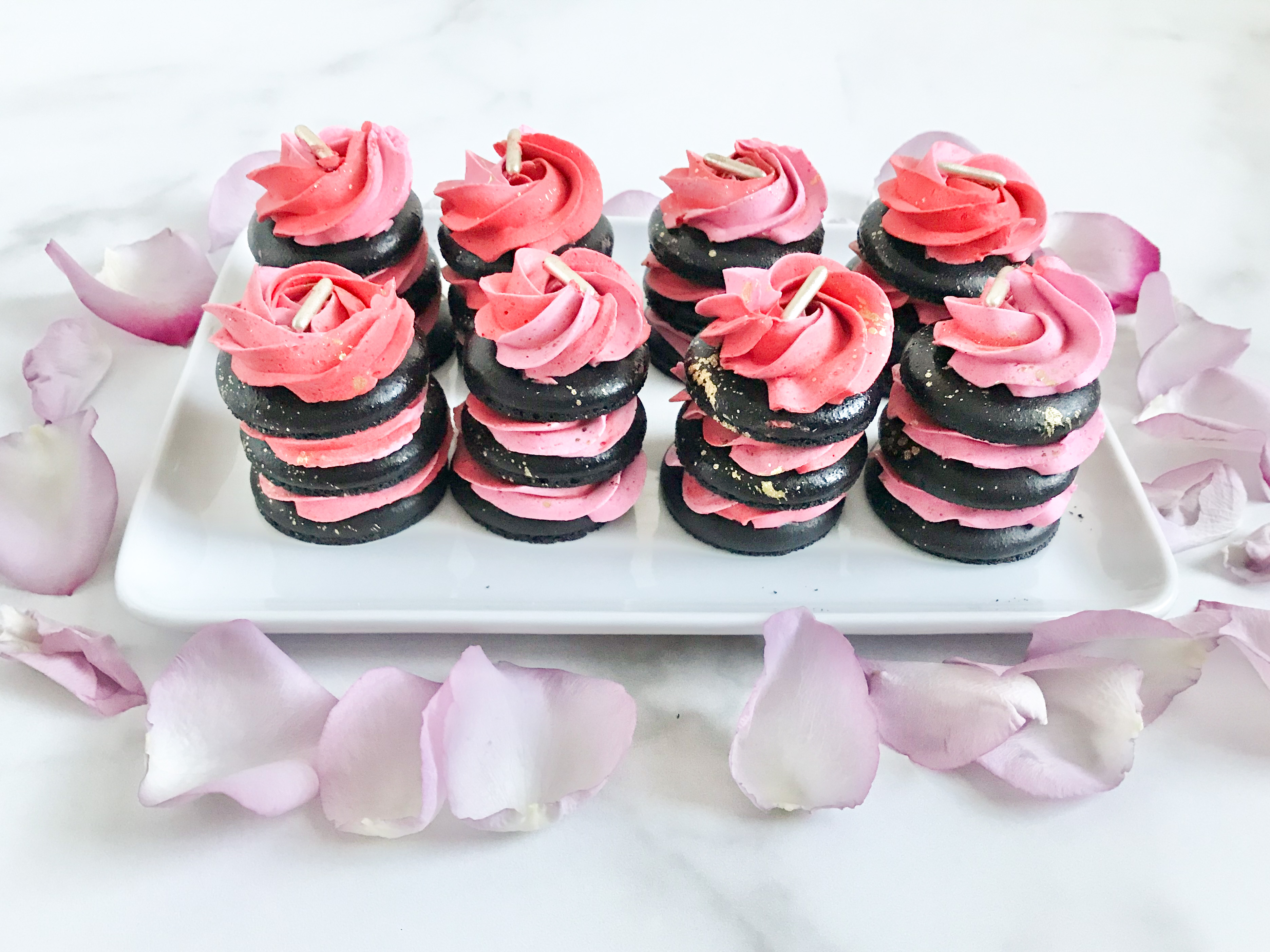 pink and red buttercream black macaron stack