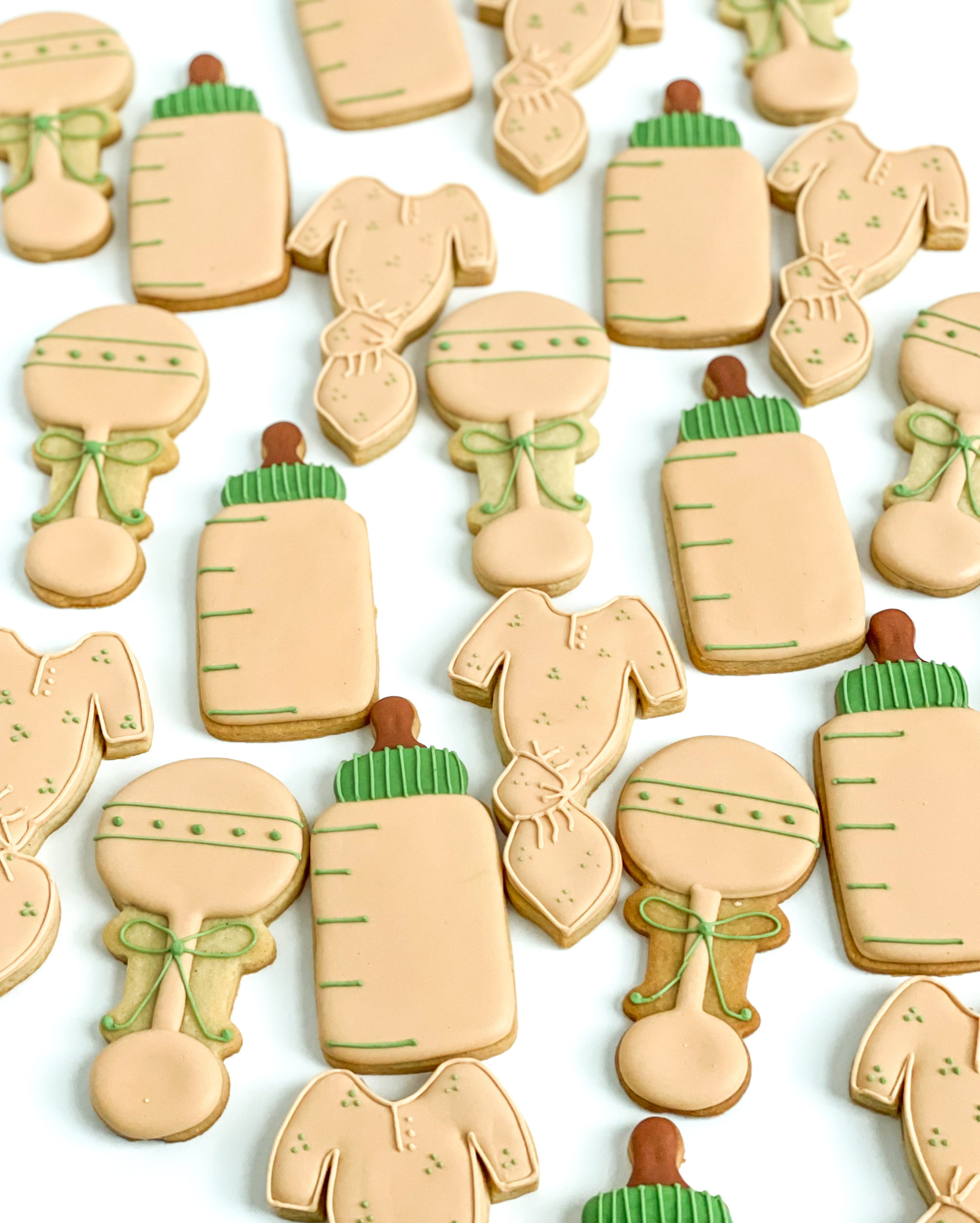nude and sage green baby shower cookies