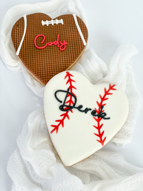football or baseball heart cookie