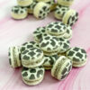 cow print macarons with cookies and cream filling
