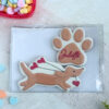 Weiner dog holding heart balloons and personalized paw print
