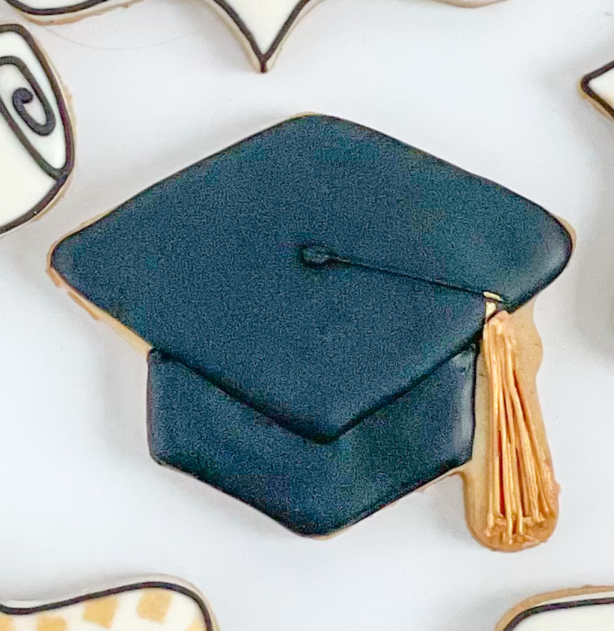 Gold tassel with black graduation cap