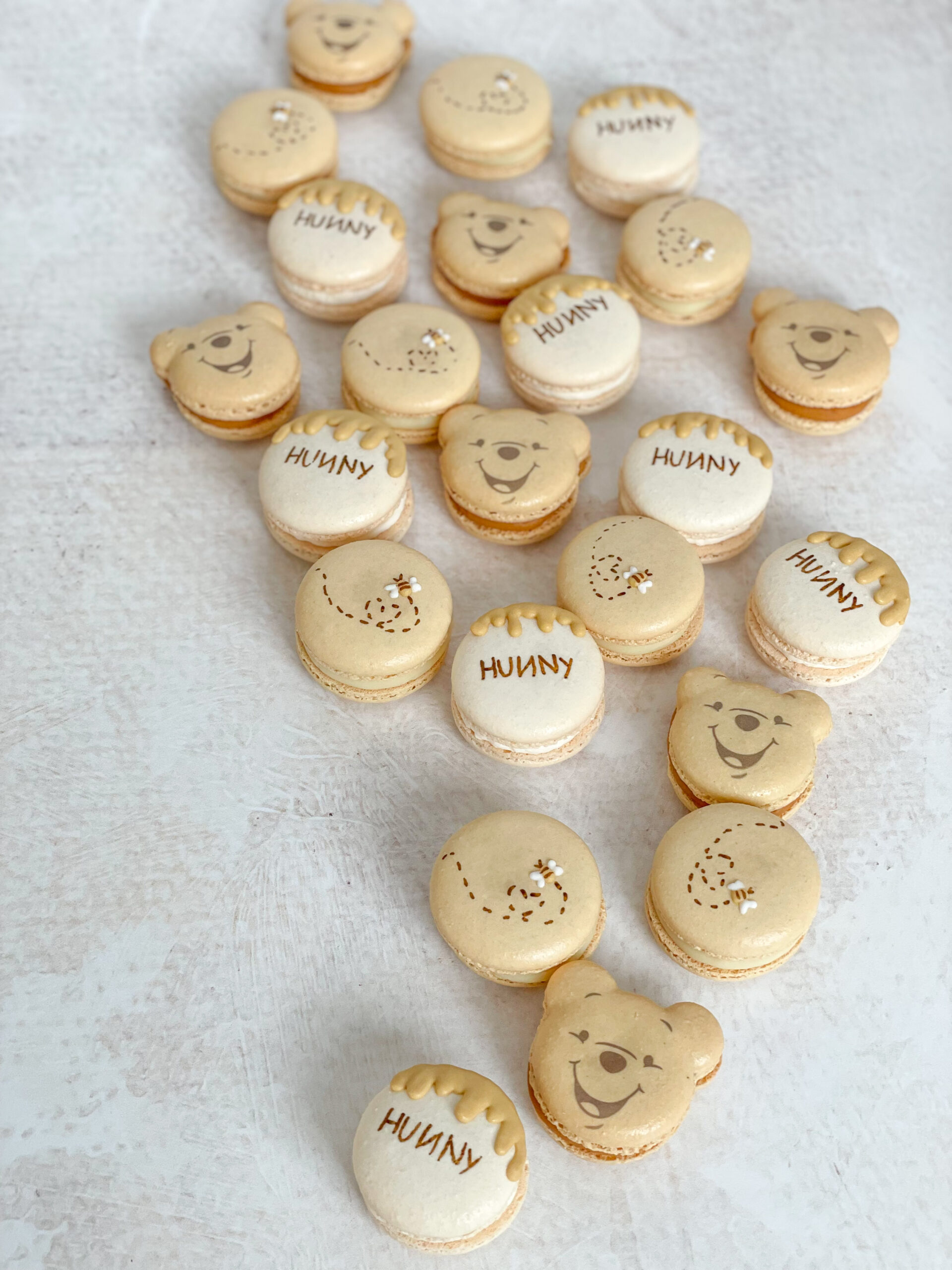 Pooh bear, hunny, and bee macarons