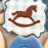 rocking horse with a light blue gingham background