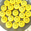 plate of smiley face macarons