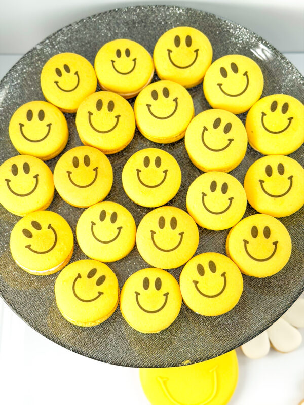 plate of smiley face macarons